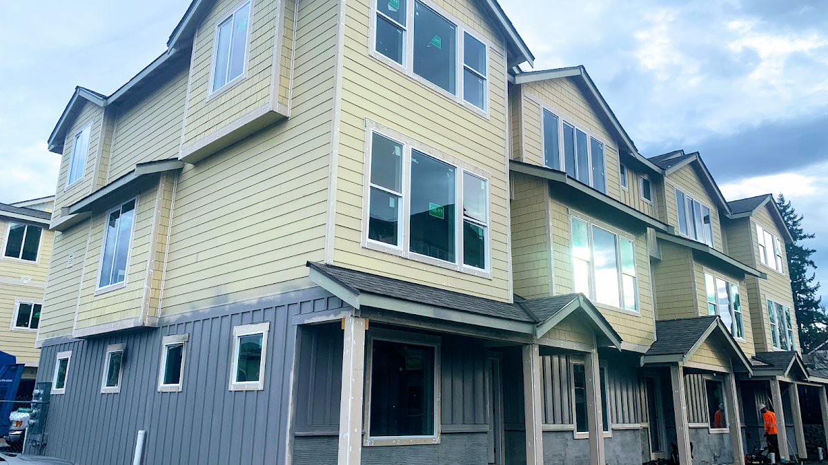 Exterior siding and construction work on a multi-unit residential project