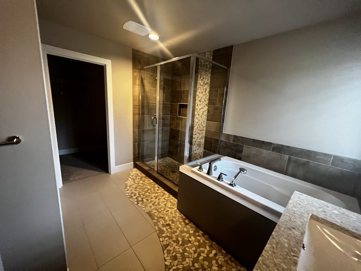 Finished primary bathroom remodel with tiled walk-in shower and soaking tub, South Sound Handyman