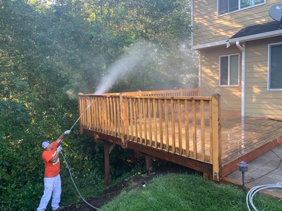 Deck power washing ahead of refinishing